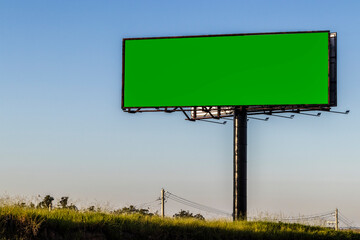 advertising sign with green background, spectacular billboard with chroma key in rural zone in...