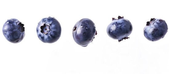 Flying Blueberries: Five Fresh Berries Cascading on White Background