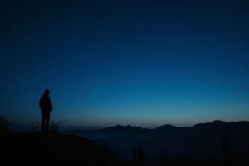 a blue sky with a moon in the distance, Show the shades of nightfall with a grainy gradient moving from twilight blue to pitch black