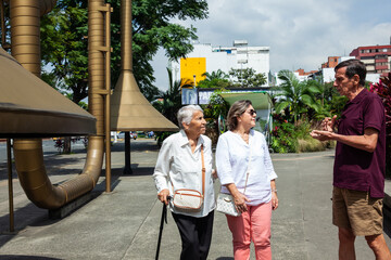 Senior tourists at the famous Jairo Varela Square. Senior travel concept.