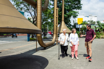 Senior tourists at the famous Jairo Varela Square. Senior travel concept.
