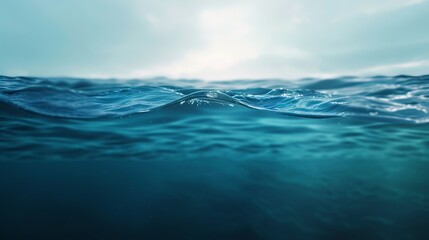 A serene view of the open ocean with gentle waves and the sun peeking through the clouds, creating a calming and peaceful atmosphere.