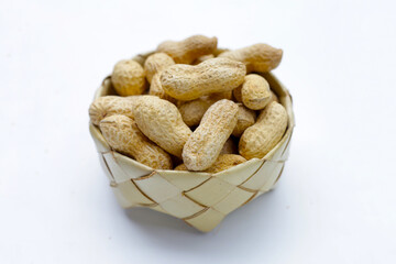 Roasted peanuts in shell on white background.