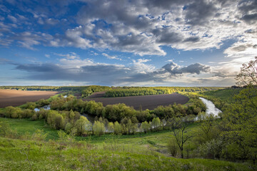 A beautiful landscape with a river running through it