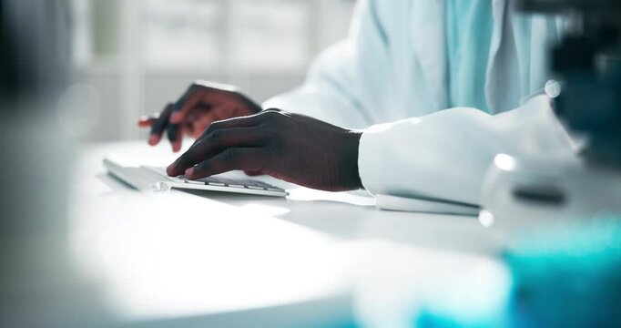 Scientist, hands and typing on computer in laboratory for research report and development for medical science. PhD biology student working on desktop or writing article on DNA synthesis at university