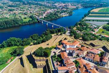 Fototapeta premium drone view of the Minho river border between Spain and Portugal, cities of Valença do Minho and Tui on each bank.
