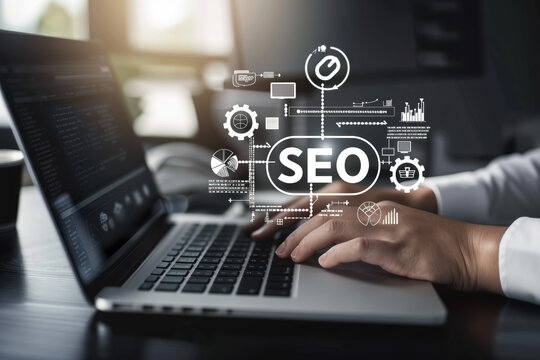 businessman behind laptop manages seo tasks