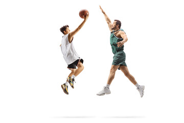 Man playing basketball with a teenage boy