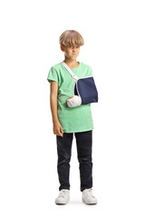Angry boy with a broken arm wearing an arm splint