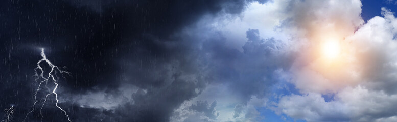 Obraz premium Blue sky with sun shining through clouds and coming thundercloud. Weather changes
