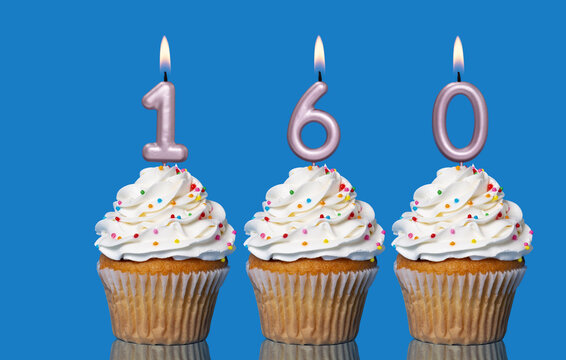 Birthday Cupcakes With Candles Lit Forming The Number 160
