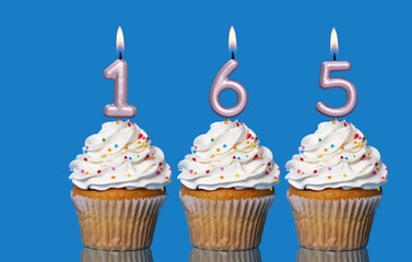Birthday Cupcakes With Candles Lit Forming The Number 165