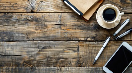 Workspace with phone pen and coffee on table Top view with copy space Office supplies on rustic wood table