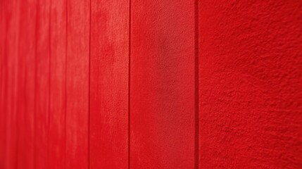 Fototapeta premium Bright red textured wooden wall provides vibrant display.