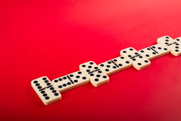 Dominoes with red background, copy space and various angles