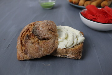 Buckwheat bun on a gray background close-up. Side view