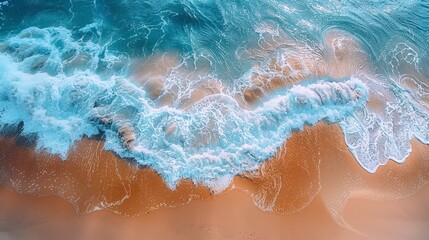 Fototapeta premium Aerial view of the sea breaking on a sandy beach