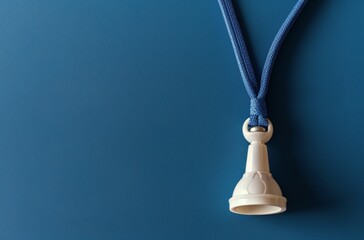 White Lanyard Clip Against a Blue Background