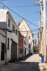 Narrow alley street lined with historic rowhouses in Baltimore