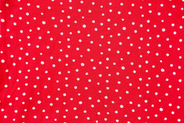 Closeup view of red polka dot fabric texture as background