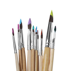 Fototapeta premium Wooden brushes with colorful paints isolated on white
