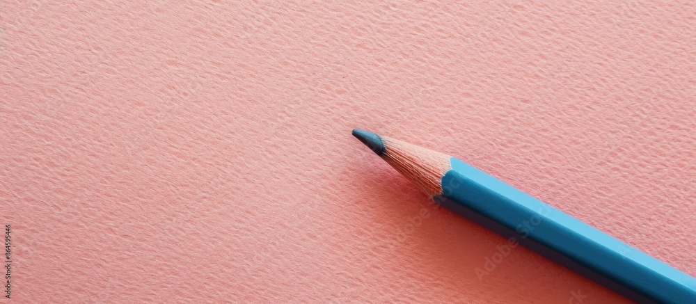 Poster top view of a desktop background featuring a pencil on paper with serene pastel tones, creating a tr
