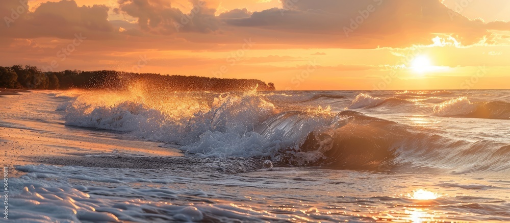 Poster sunset on the ocean shore with waves, creating a picturesque scene with a serene ambiance in the cop