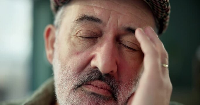 Headache, massage and senior man with stress, pain and elderly person in nursing home and retirement. Rehabilitation, migraine and overwhelmed with Parkinson disease, illness and dizzy in house