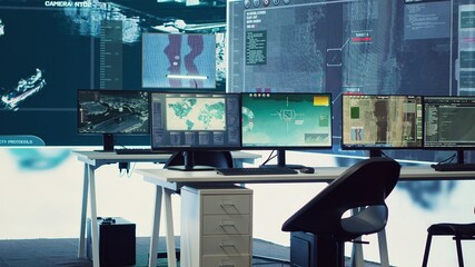 Military operations center used in monitoring global threats on a big screen, empty federal...
