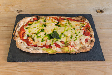 Margherita, A classic Italian pizza made with tomato sauce, fresh mozzarella cheese, fresh basil and a drizzle of olive oil 2