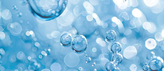 Gentle light blue bubbles and luminous droplets against a copy space image.