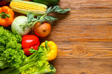 Different fresh vegetables on wooden background