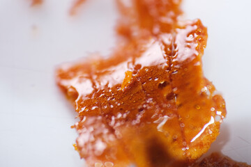 Macro shot of homemade honeycomb made using white sugar and bicarbonate powder