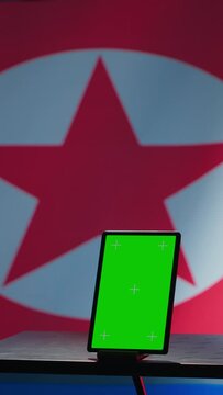 Vertical video North Korean engineer makes troll accounts with mockup tablet on social media promoting communist ideology. Admin works for Pyongyang regime building algorithms to spread government