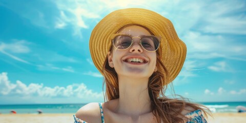 A woman relaxing on the beach, wearing a hat and sunglasses