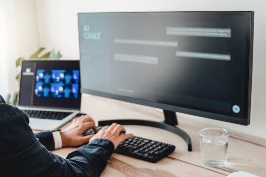 AI image generator app. Person creating photo art with prompts on Artificial Intelligence software in computer laptop. Technology trends