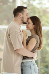 Fototapeta premium Happy couple hugging at home. Strong relationship