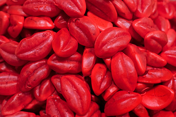 abstract background of chewing candies in the shape of lips. Valentine's Day