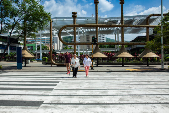 Senior tourists at the famous Jairo Varela Square. Senior travel concept. Senior people crossing the road using the crosswalk. Road safety. Pedestrian road safety