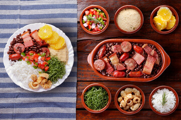 Brazilian feijoada, traditional food from Brazil cuisine, on ceramic casserole bowl, over rustic wooden table
