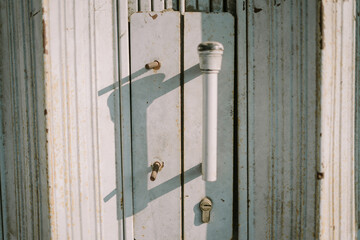 Metal handle of a rolling door, emphasizing durability and functionality in industrial settings