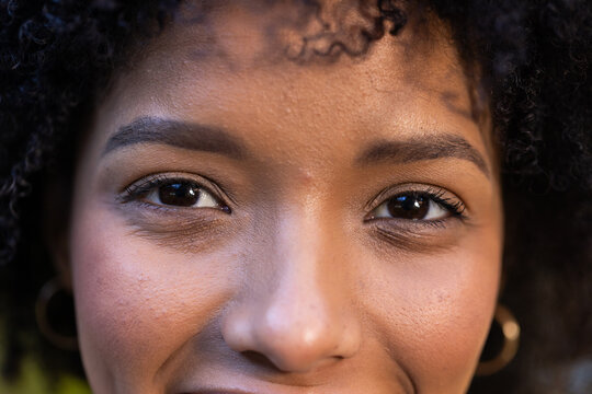 Close-up of African American woman smiling, showing natural beauty and confidence