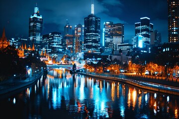 Fototapeta premium Night cityscape of Melbourne, Australia with bright lights reflecting on the Yarra River. Cityscape photography at night with vivid colors.