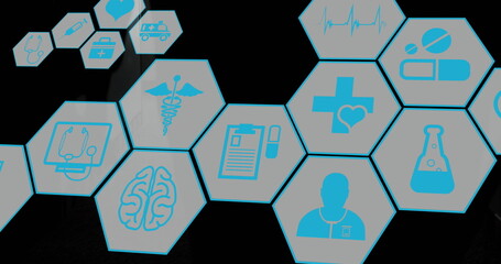 Image of hexagon shapes with medical icons moving over man walking in hospital corridor