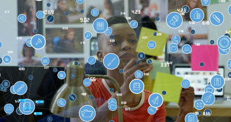 Image of data processing over african american businesswoman taking notes