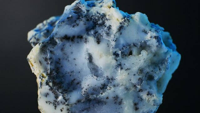 Dendritic Agate, milky white with tree-like inclusions, symbolizes growth and abundance. Formula: SiO2. Hardness 6.5-7. Composed of chalcedony quartz. Valued for emotional stability, inner peace