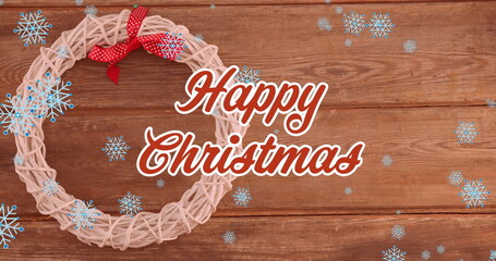 Image of christmas greetings text over snow falling and christmas decorations