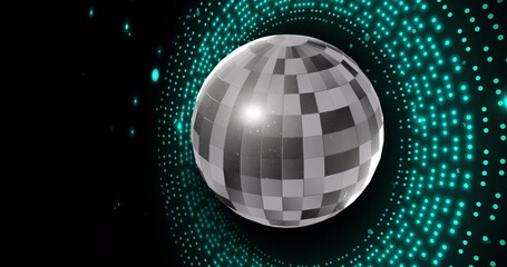 Image of retro disco mirror ball and glowing blue light on black background