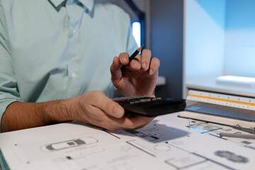 an engineer is using calculator to find the correct numbers for construction, the architect...