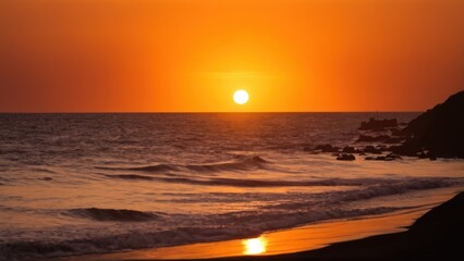 a photograph of the sun is setting over the ocean on a hill overlooking the beach and the ocean